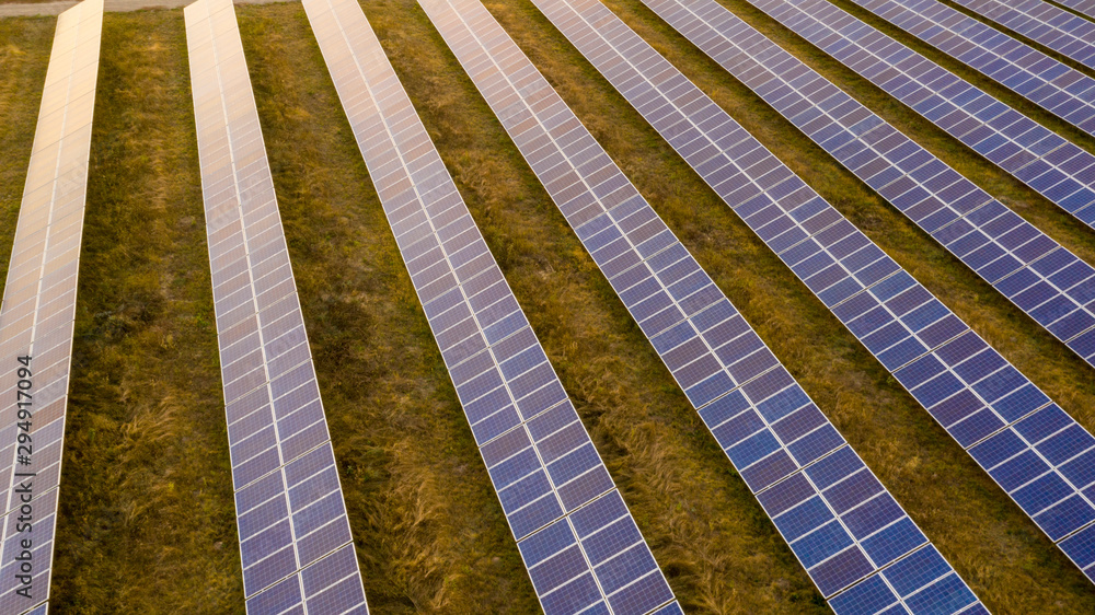 Renewable electricity, unmanned flight over a solar power plant located in the field. Renewable electricity, unmanned flight over a solar power plant located in the field.