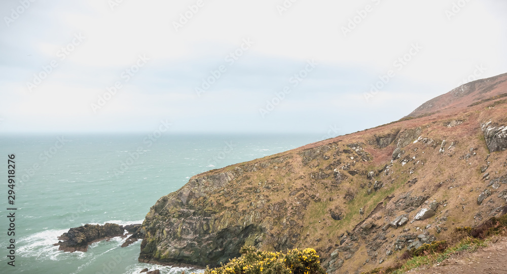 hiking trail on cliff skirting the sea in Howth