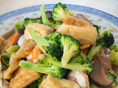 Closeup of stir fry vegetable dish with fried tofu