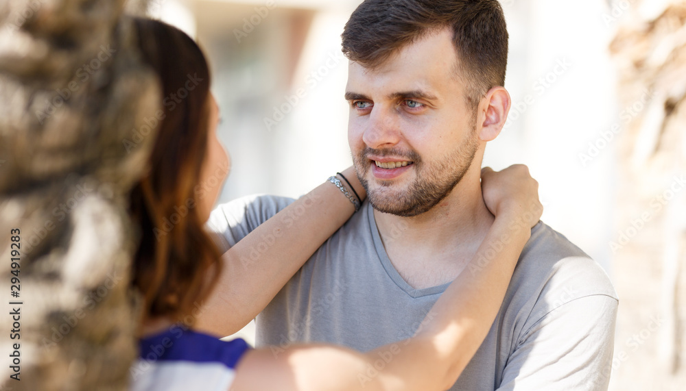 Fototapeta premium Happy man and girl talking and hugging