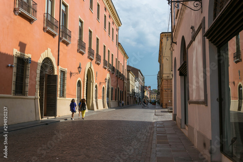 People walking in a old street town in Italy