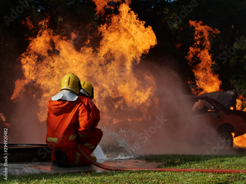 firefighter spray water to fire burning car workshop fire training