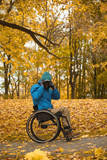 wheelchair - disabled photographer in autumn park