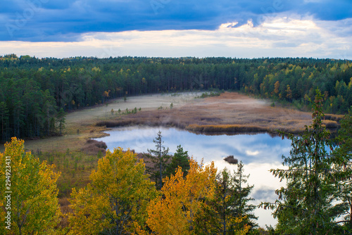 Latvian autumn nature. Forest and Kangari lake. View from the top.