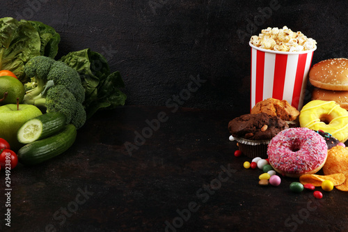 healthy or unhealthy food. Concept photo of healthy and unhealthy food. Fruits and vegetables vs donuts and fast food