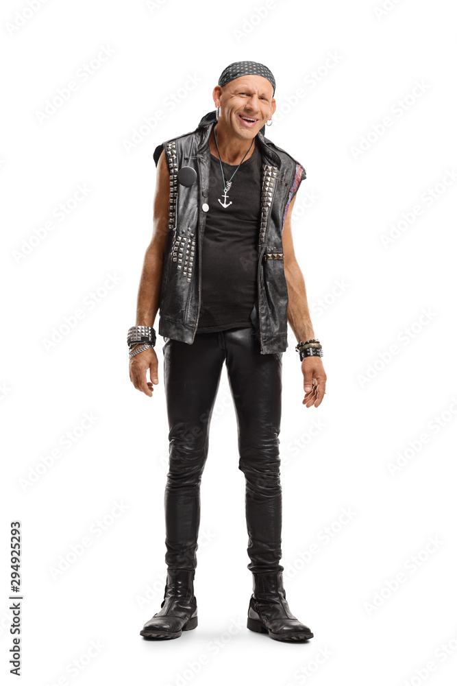 Happy punker in a leather outfit smiling at the camera Happy punker in a leather outfit smiling at the camera