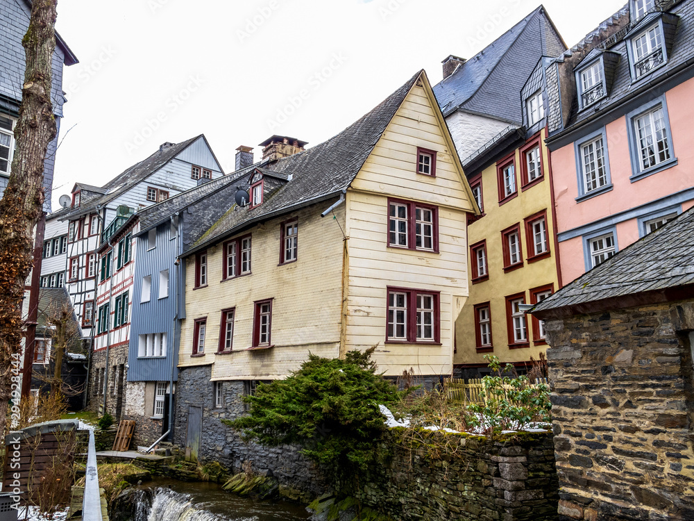Preserved old half-timbered buildings along the Rur River in Monschau downtown, Germany