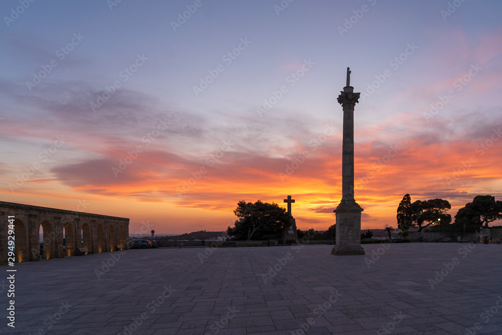 Sunset at Santa Maria di Leuca. Santa Maria di Leuca, Colonna Corinzia - Salento, Lecce, Apulia, Italy . Religious symbol, crucifix, cross - Immagine