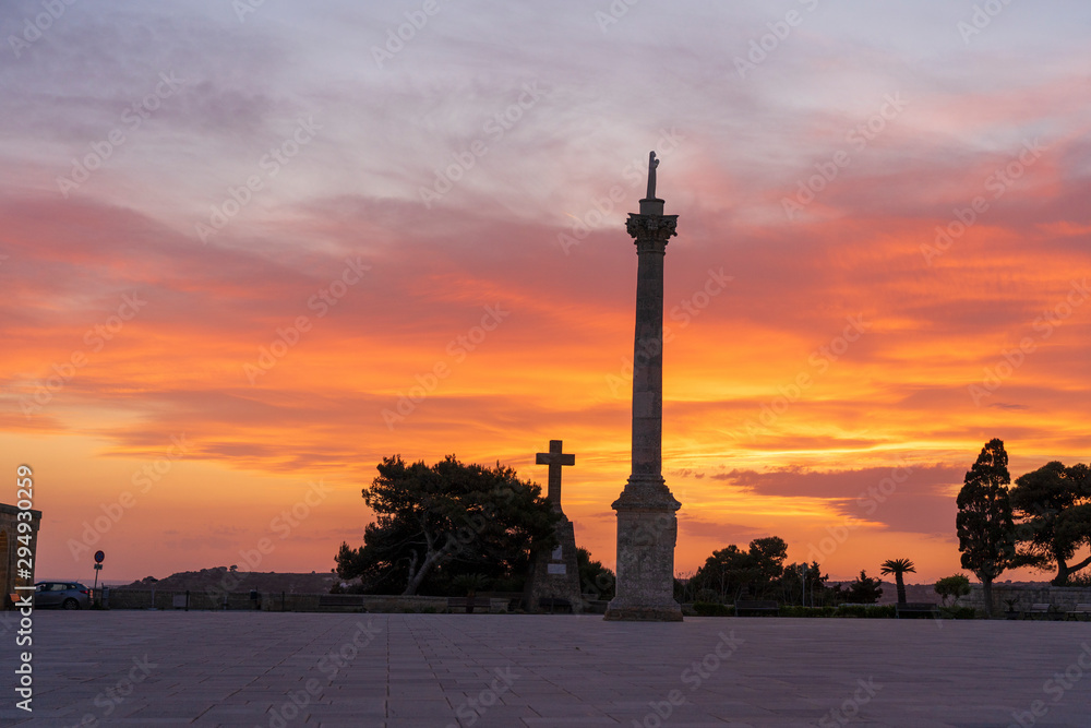 Sunset at Santa Maria di Leuca. Santa Maria di Leuca, Colonna Corinzia - Salento, Lecce, Apulia, Italy . Religious symbol, crucifix, cross - Immagine