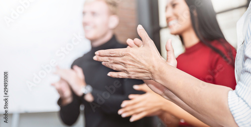 фотографія Portrait of partners clapping hands in business seminar