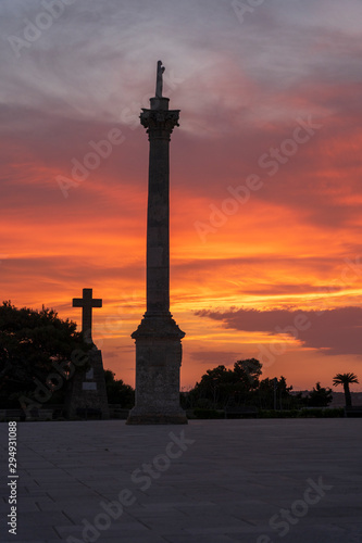 Sunset at Santa Maria di Leuca. Santa Maria di Leuca  Colonna Corinzia - Salento  Lecce  Apulia  Italy . Religious symbol  crucifix  cross - Immagine