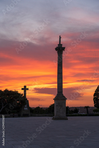 Sunset at Santa Maria di Leuca. Santa Maria di Leuca  Colonna Corinzia - Salento  Lecce  Apulia  Italy . Religious symbol  crucifix  cross - Immagine