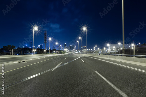 Empty Freeway At Night And Tel Aviv Skyline in Background © Dmitry Pistrov
