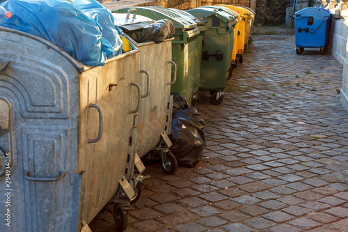 Garbage bins line up on a residential street