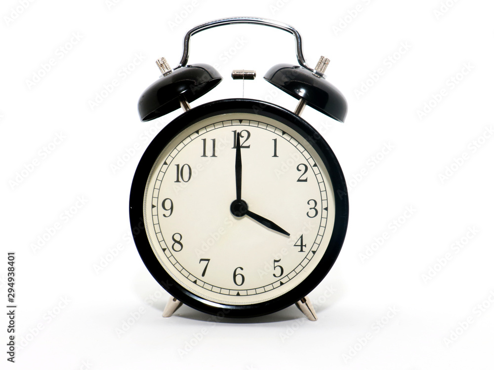 Old-style alarm clock, black and white, it's four o'clock. Old-style alarm clock, black and white, it's four o'clock.
