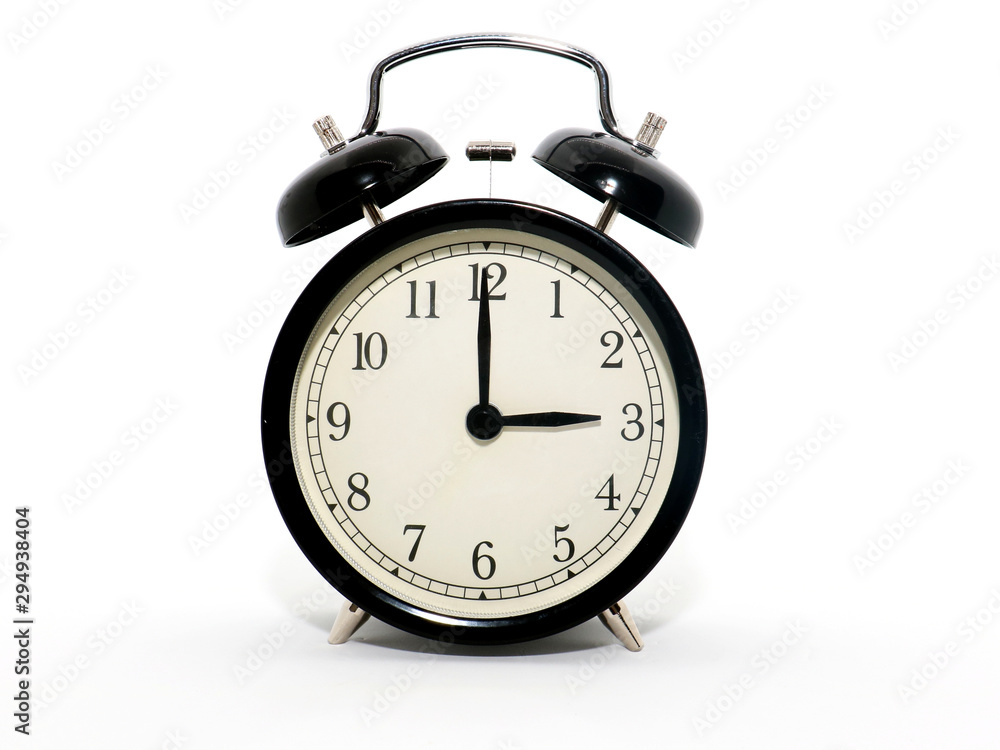 Old-style alarm clock, black and white, it's three o'clock. Old-style alarm clock, black and white, it's three o'clock.