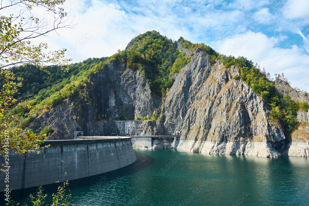 Dam and reservoir on Lake Vidraru. Hydropower construction, waterworks