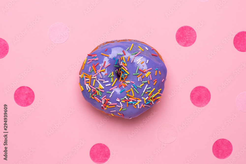 Sweet lilac donut with marshmallows on a pink background flat lay Sweet lilac donut with marshmallows on a pink background flat lay