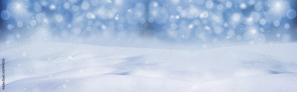 Winter snow background with snow flakes on the blue sky, banner format