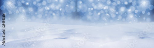 Winter snow background with snow flakes on the blue sky, banner format