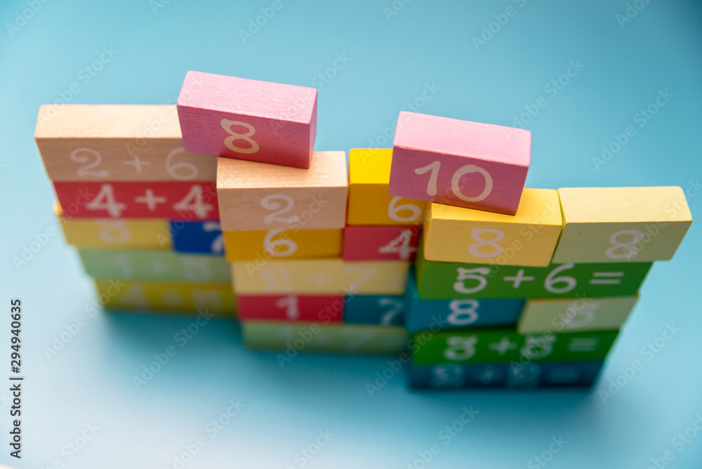 colored cubes with numbers on a blue background colored cubes with numbers on a blue background