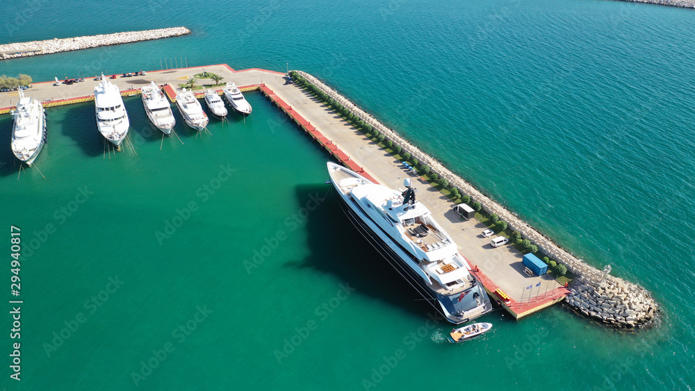 Aerial photo of luxury yachts docked in Mediterranean marina