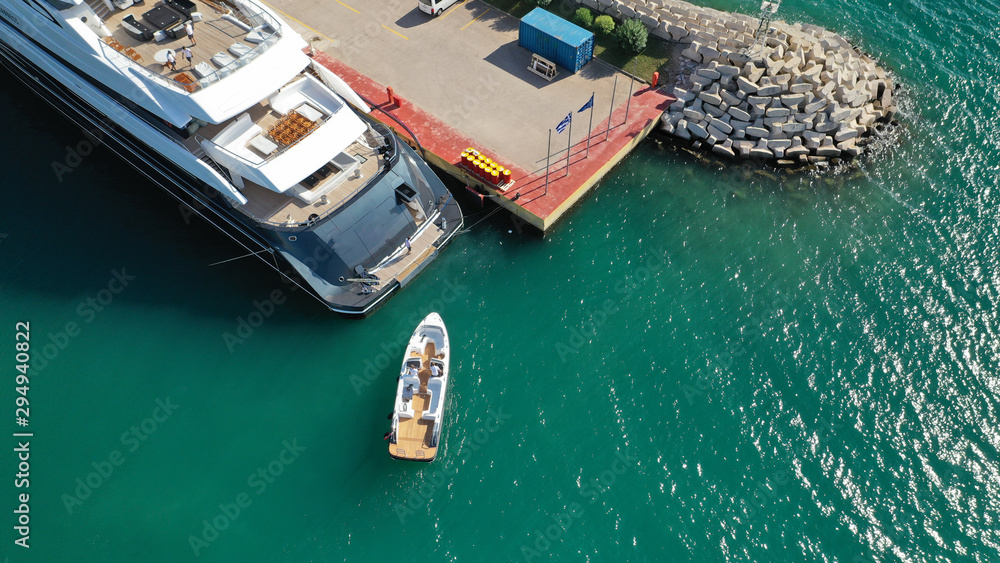 Aerial photo of luxury yachts docked in Mediterranean marina