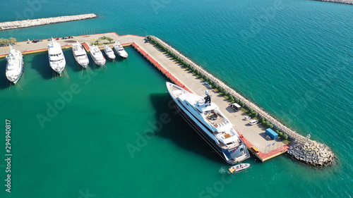 Aerial photo of luxury yachts docked in Mediterranean marina