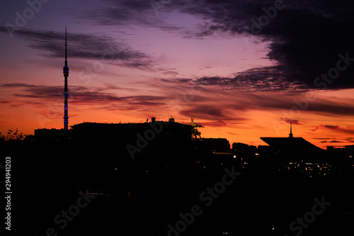 Photography Silhouette of Moscow buildings at sunset with a statue of a worker and a collective farmer and Ostankino tower at VDNH, Moscow