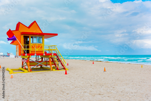 Red and orange lifeguard tower in Miami Beach on a cloudy day © Gabriele Maltinti