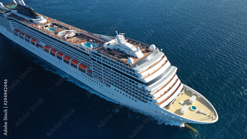 Aerial top view photo of huge cruise liner with pools and outdoor facilities cruising the Atlantic blue ocean - obrazy, fototapety, plakaty 