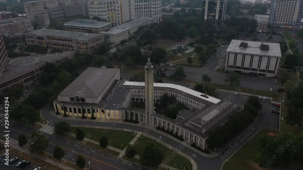 4K Ariel Drone Shot Passing Over Tall Building In Atlanta, Georgia USA. Area With Tall Skyline Buildings. Green Grass And Tree Area. Busy Car Parks And Offices 4K Ariel Drone Shot Passing Over Tall Building In Atlanta, Georgia USA. Area With Tall Skyline Buildings. Green Grass And Tree Area. Busy Car Parks And Offices