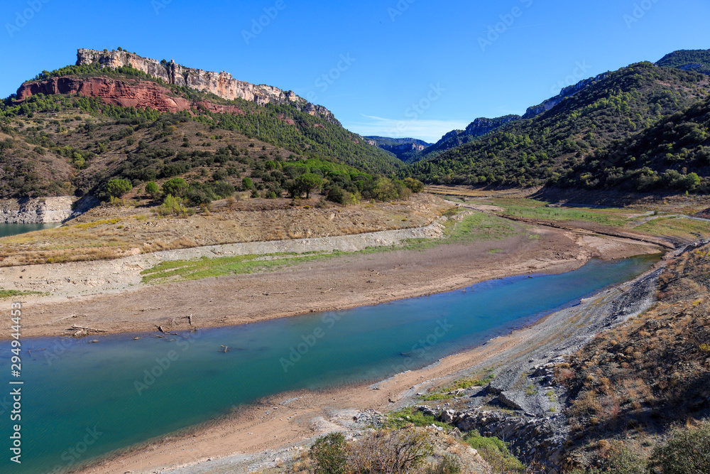 View of almost empty Siurana water reservoir, Tarragona, Spain