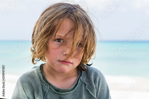 Close up of boy on beach photo