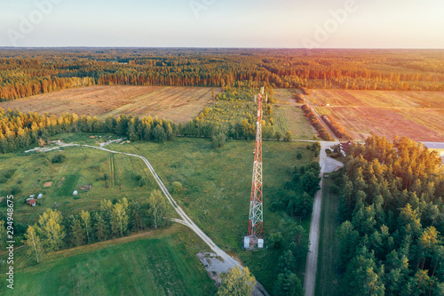 Mobile communication tower during sunset from above.