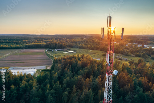 Mobile communication tower during sunset from above.