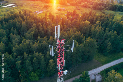 Fototapeta Mobile communication tower during sunset from above.
