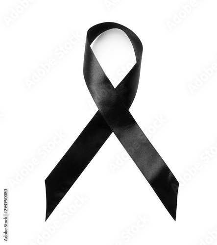 Black ribbon on white background, top view. Funeral symbol