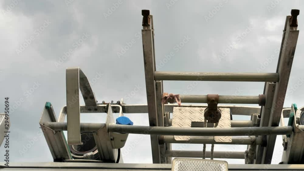 25205_A_steel_ladder_on_top_of_the_old_truck.mov 25205_A_steel_ladder_on_top_of_the_old_truck.mov
