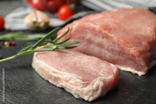 Fresh raw cut meat on grey table, closeup
