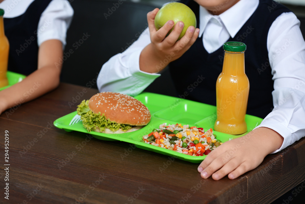 Children with healthy food for school lunch at desk, closeup