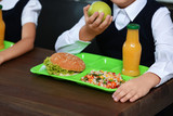 Children with healthy food for school lunch at desk, closeup