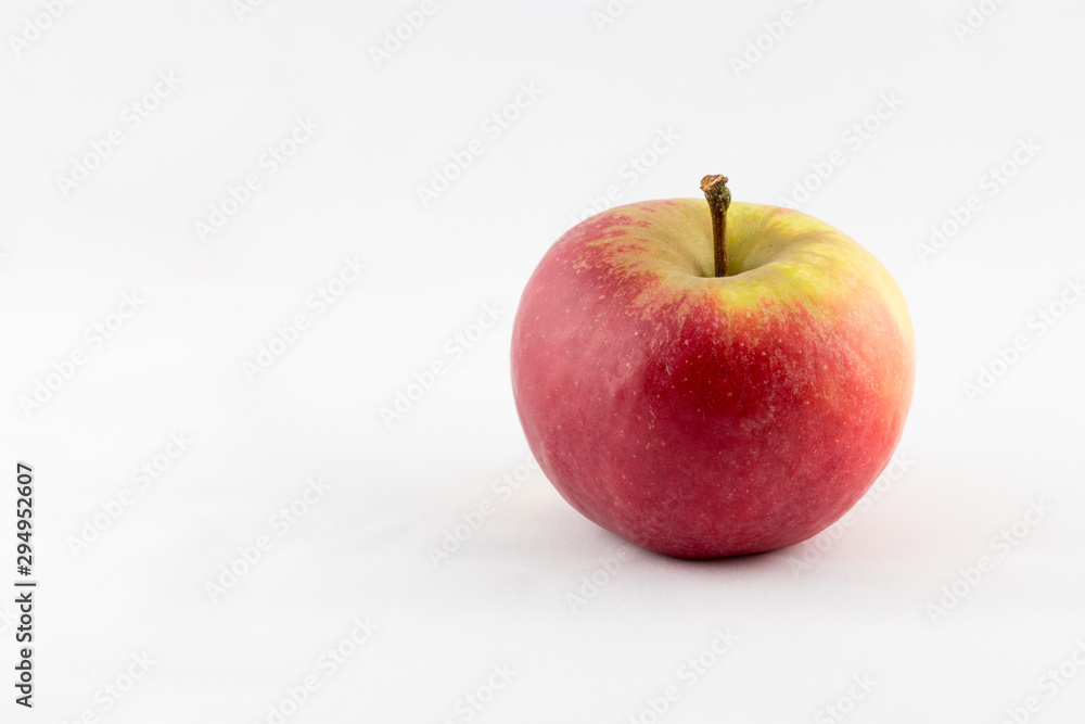 Ein Apfel als Symbol für Essen vor weißem Hintergrund Stock Photo | Adobe  Stock