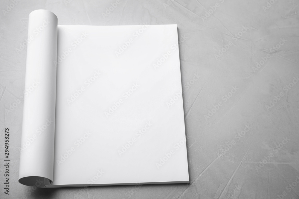 Blank open book on light grey stone background. Mock up for design Blank open book on light grey stone background. Mock up for design