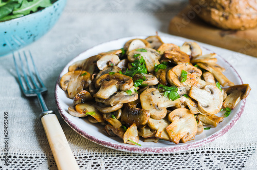 Canvas Print Champignons mushrooms sauteed with onion and garlic