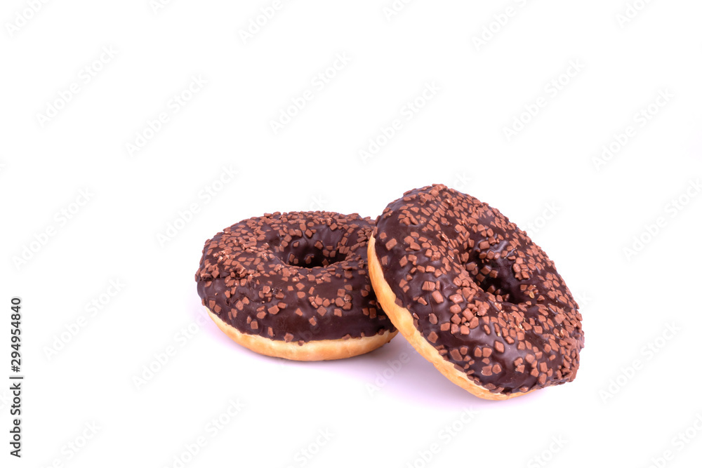 two chocolate donuts are beautifully depicted on a white background close-up, covered with a sweet brown glaze and decorated with powder two chocolate donuts are beautifully depicted on a white background close-up, covered with a sweet brown glaze and decorated with powder