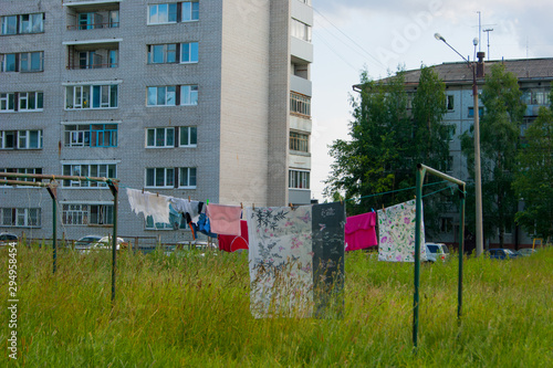 Big wash - the clothes dry on the clothesline in the courtyard of the city