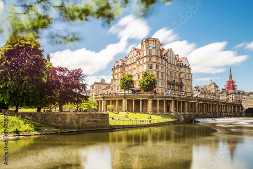 The Pulteney Bridge in Palladian style crosses the River Avon in Bath