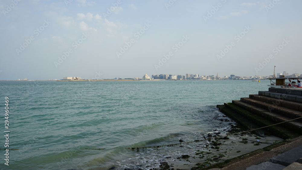 sea, water, beach, sky, ocean, coast, boat, blue, travel, sand, landscape, ship, summer, nature, harbor, tourism, city, sunset, pier, waves, clouds, bay, horizon, Doha