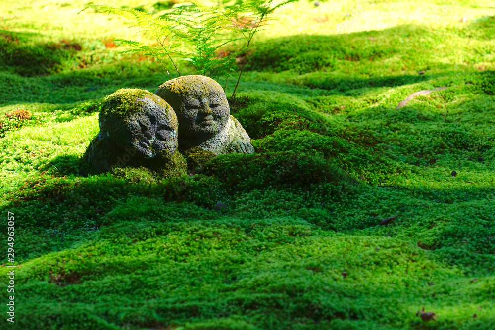 Fototapeta premium The moss garden and stone statues in the Sanzenin temple, Ohara, Kyoto, Japan